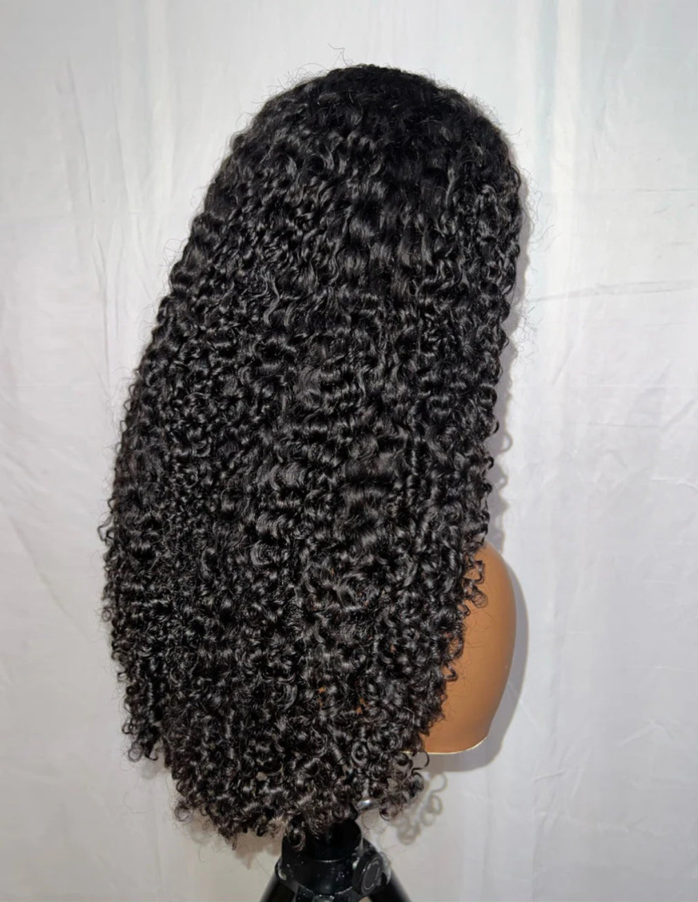 Back view of KAI Natural Black Kinky Curly Wig, 7x5 Lace, Human Hair, Layered 4C Curls, Full Volume, Gorgeous