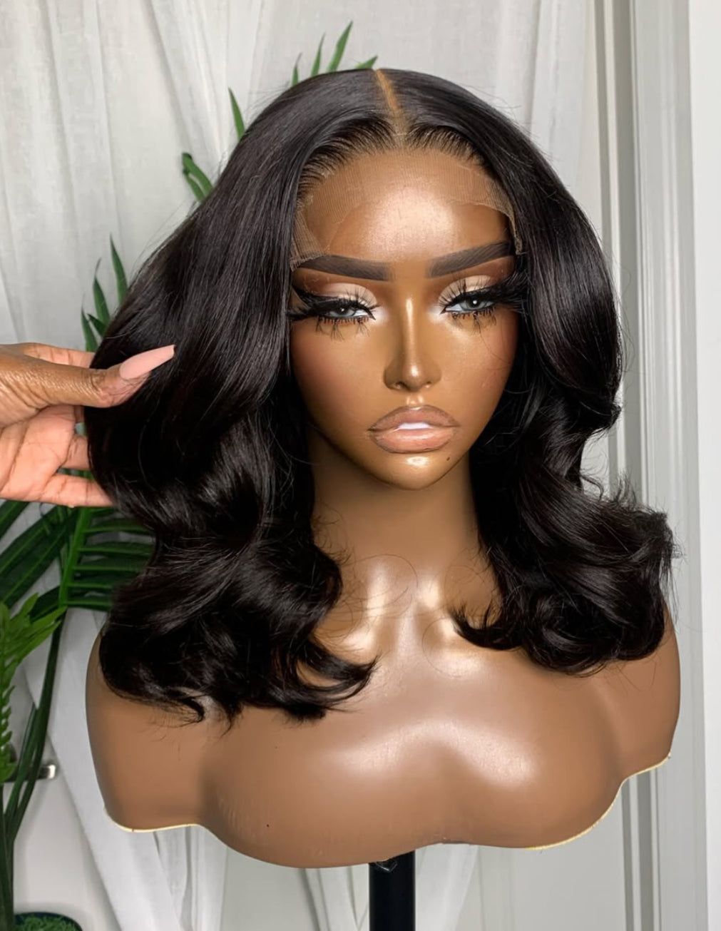 Close-up of LEILA Beach Wave Bob Wig hair strands, Natural Black, 14-16", 7x5 Lace Closure, Human Hair, Smooth Shiny Texture, Gorgeous