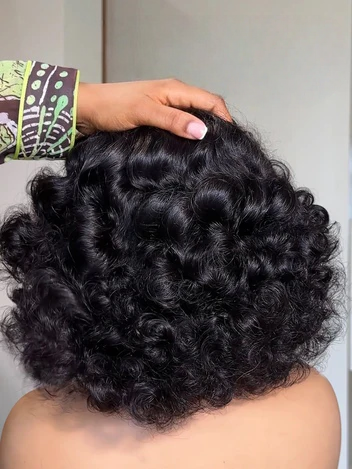TIANA headband wig natural black deep wave curly back view soft waves full coverage hand-tied natural look