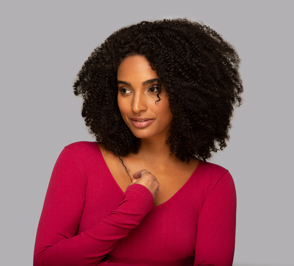 Front view of Natural Black Kinky Curly Wig on model, 14-22", 13x4 Lace, Human Hair, Voluminous Curls, Chic and Trendy