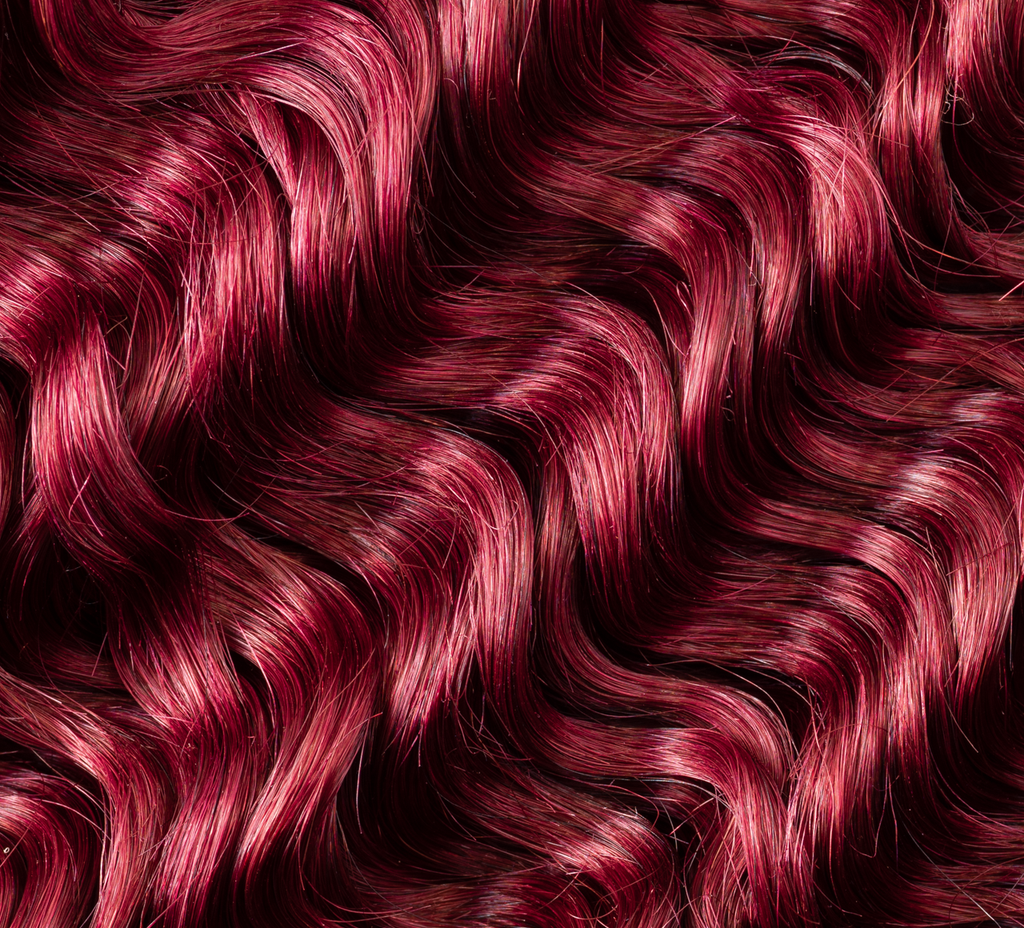 brazilian deep wave hair bundle close-up soft defined curls vibrant burgundy shiny bouncy texture