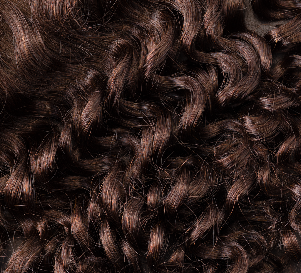 brazilian deep wave hair bundle close-up soft defined curls chocolate brown shiny bouncy texture