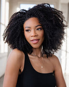 Natural Black Kinky Curly Wig on model, 14-22", 13x4 Lace, Human Hair, Soft Bouncy Curls, Stylish and Wear-and-Go