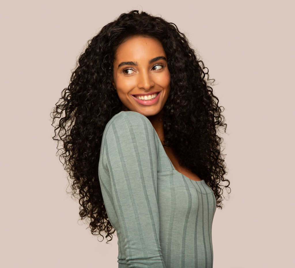 Model wearing Natural Black Water Wave Wig, 13x4 Lace Frontal, 18-24 inch, pre-plucked natural hairline, seamless melt, realistic scalp look.
